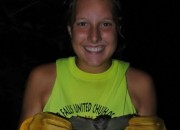 Central College senior Jessica Riebkes holds an endangered Indiana bat caught during her internship with Stantec, an environmental consulting firm.