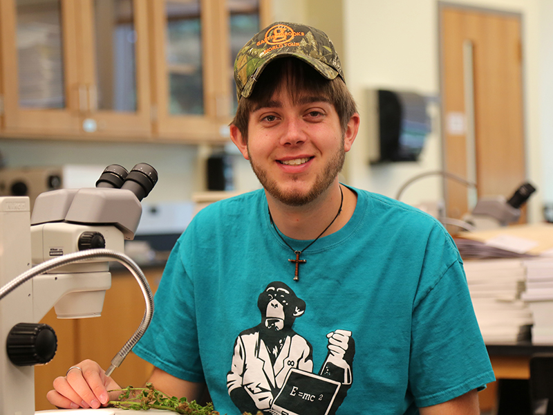 Zane Peters ’16, biology major, was one of 23 student researchers on campus this summer. He’s studying an invasive plant, purple loosestrife, and getting ready for graduate studies in environmental science.