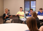 Karin Peterson, Pella Corp. vice president of human resources, talks with Central College students about women in executive leadership positions.