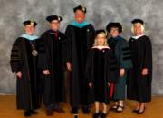 Central College President Mark Putnam, left, is joined by Lt. Gov. Adam C. Gregg, Steven C. Van Wyk, Catherine B. Elwell, Mary E. M. Strey, Central's Vice President of Academic Affairs and Dean of Faculty, and Sunny Gonzales Eighmy, Central's Vice President for Advancement. Central bestowed special honors on Gregg, Van Wyk and Ewell during commencement.