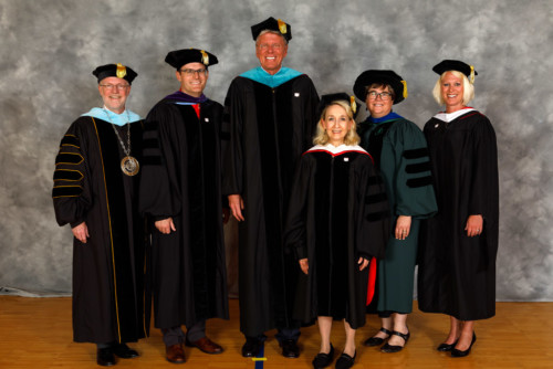 Central College President Mark Putnam, left, is joined by Lt. Gov. Adam C. Gregg, Steven C. Van Wyk, Catherine B. Elwell, Mary E. M. Strey, Central's Vice President of Academic Affairs and Dean of Faculty, and Sunny Gonzales Eighmy, Central's Vice President for Advancement. Central bestowed special honors on Gregg, Van Wyk and Ewell during commencement.