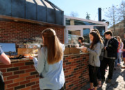 Students at a cookout on the Maytag Student Center patio