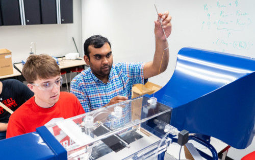 Assistant Professor of Physics and Engineering Pavithra Premaratne leading a wind tunnel experiment with students.