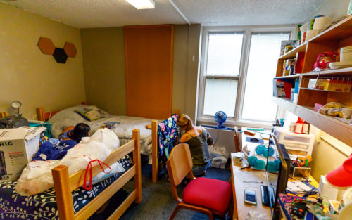 Students unpack their belongings as they move in for the fall semester.