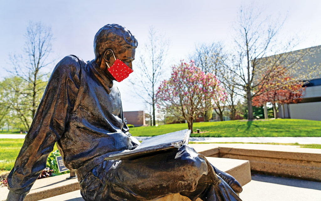 A thoughtful Central community member fitted The Quest, Central’s bronze likeness of Harold Geisler, with a mask while studying and practicing physical distancing on the Peace Mall.