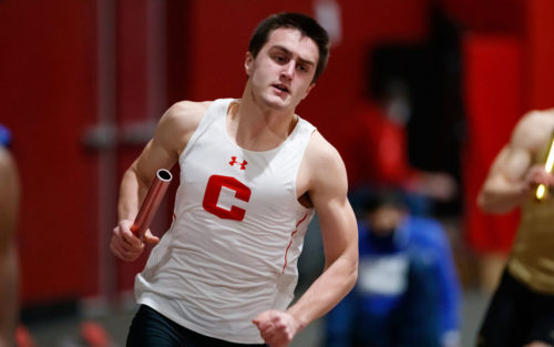 Grant Boyse carries the baton during the 4x400-meter relay in a Central College Indoor Track & Field Nebraska Wesleyan/Dubuque triangular on February 13.