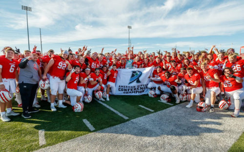 Central College football team celebrating their American Rivers Conference title.