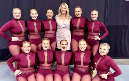 The Central College Dance Team and coach Lexi Gbogbo posing for a photo at the Iowa State Dance and Drill Team Championships