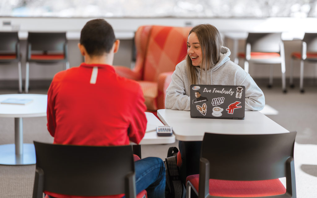 Two Central College students collaborating in Geisler Library