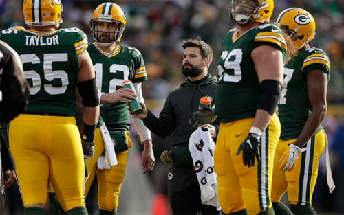 Nate Weir '05 with Green Bay Packers players.