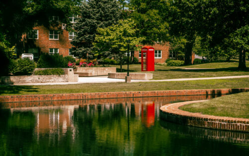 Central's red phonebooth by pond