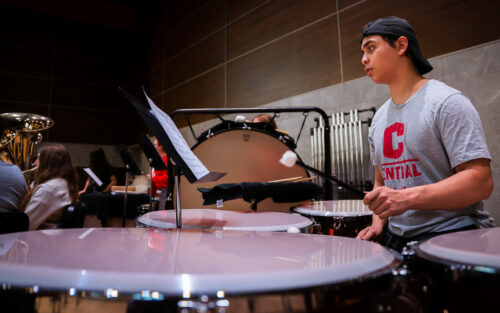 Symphony practice with large timpani drums in foreground