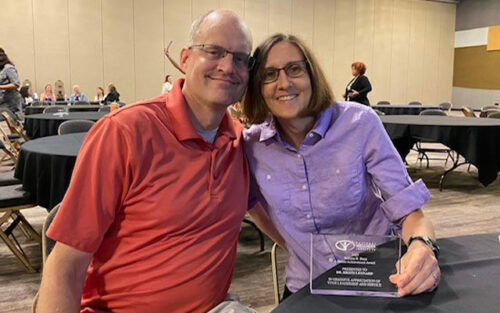 Terry Oliphant and Kristi Leonard '97 with award