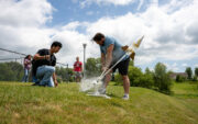 Two students launching water rockets.