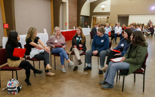 Group of six prospective students with Anya Butt during Scholar Day.