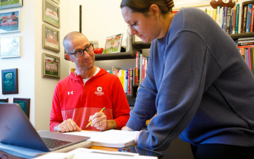 Professor Russ Goodman with a student