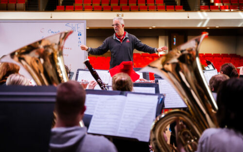 Brad Lampe directing students during practice