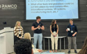 Four students standing on stage. North Lindall is second from left.