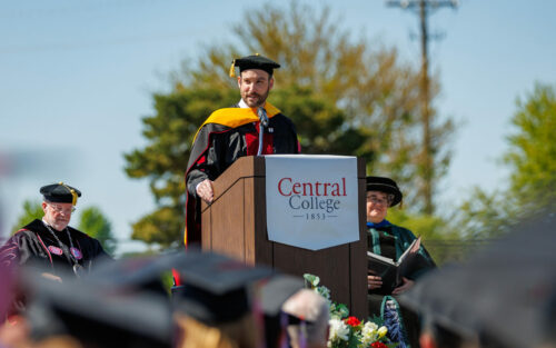 Adam Duerfeldt '06 speaking at commencement