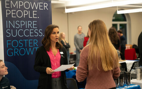 A woman speaking with a Central student about careers.