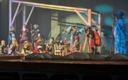 Stage photo of puppetry and actors on a stage