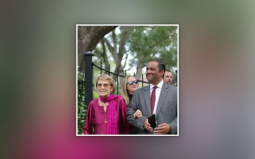 Wilma David in pink top escorted by her son, Rajakumar David