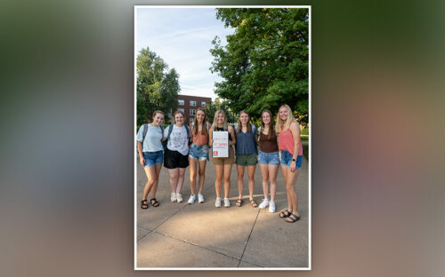 Group of seven female students on first day of classes.