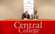 Central College President Mark Putnam signed a new agreement with Mercy College President Adreain Henry