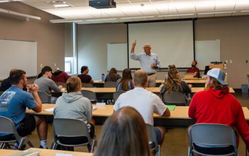 Harry Smith '73 leading a class