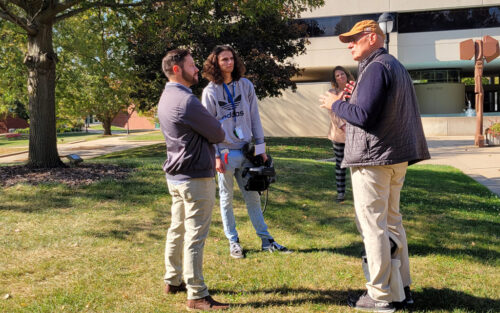 KCCI team and Harry Smith outside Geisler Library