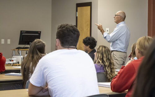 Harry Smith '73 in the class with students