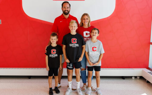 Garrett Hill, Class of 2009, and his wife, Emily, and three boys.